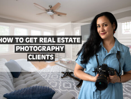 woman photographer with long black hair in bright living room i